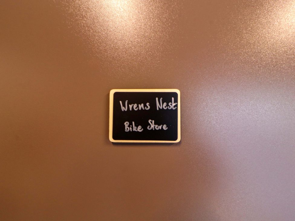 A sign reading Wrens Nest Bike Store