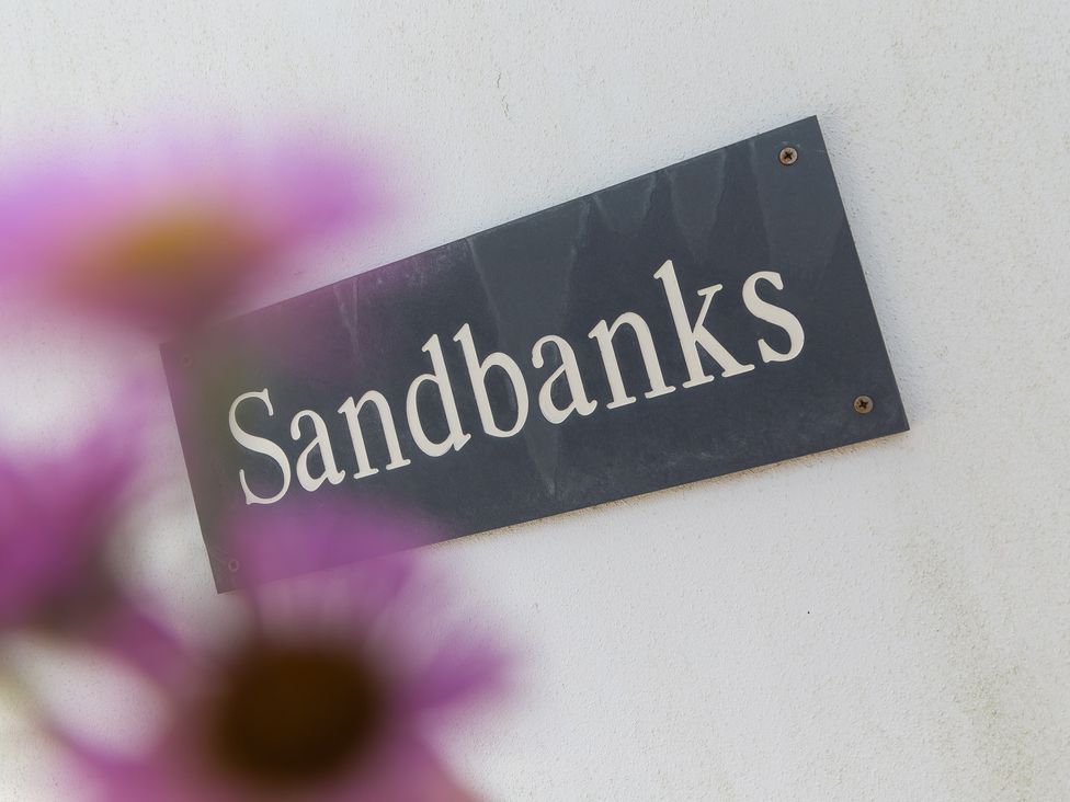A sign that reads Sandbanks at Sandbanks in Praa Sands