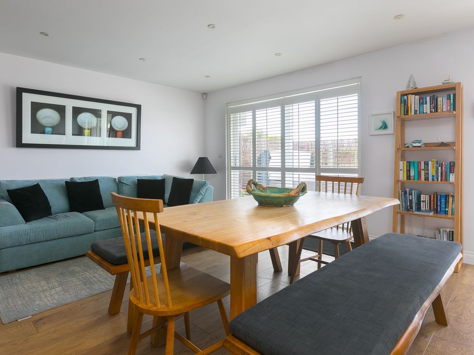 A dining room with a table and chairs at Sandbanks, Praa Sands