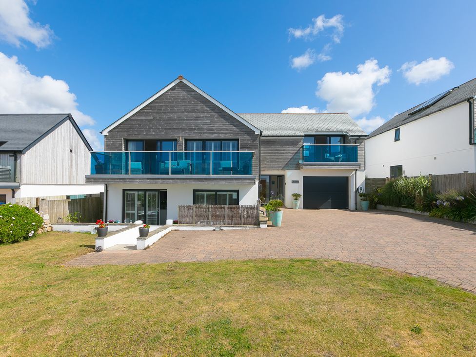 A house with a balcony and garage at Sandbanks in Praa Sands