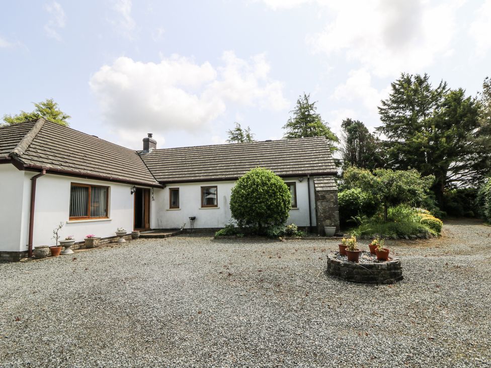 A house with a gravel driveway and garden at Kala in Spittal near Haverfordwest