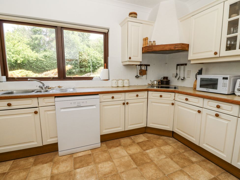 A kitchen with cabinets and appliances at Kala in Spittal near Haverfordwest