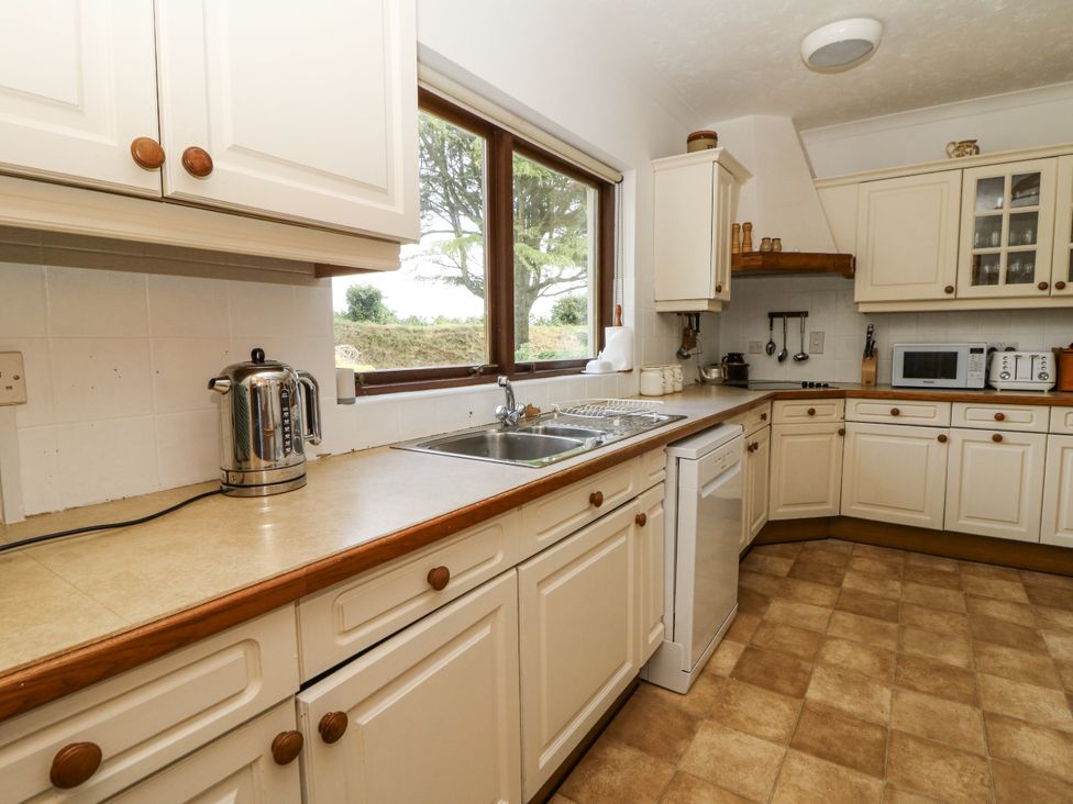 A kitchen with a sink and cupboard at Kala in Spittal near Haverfordwest