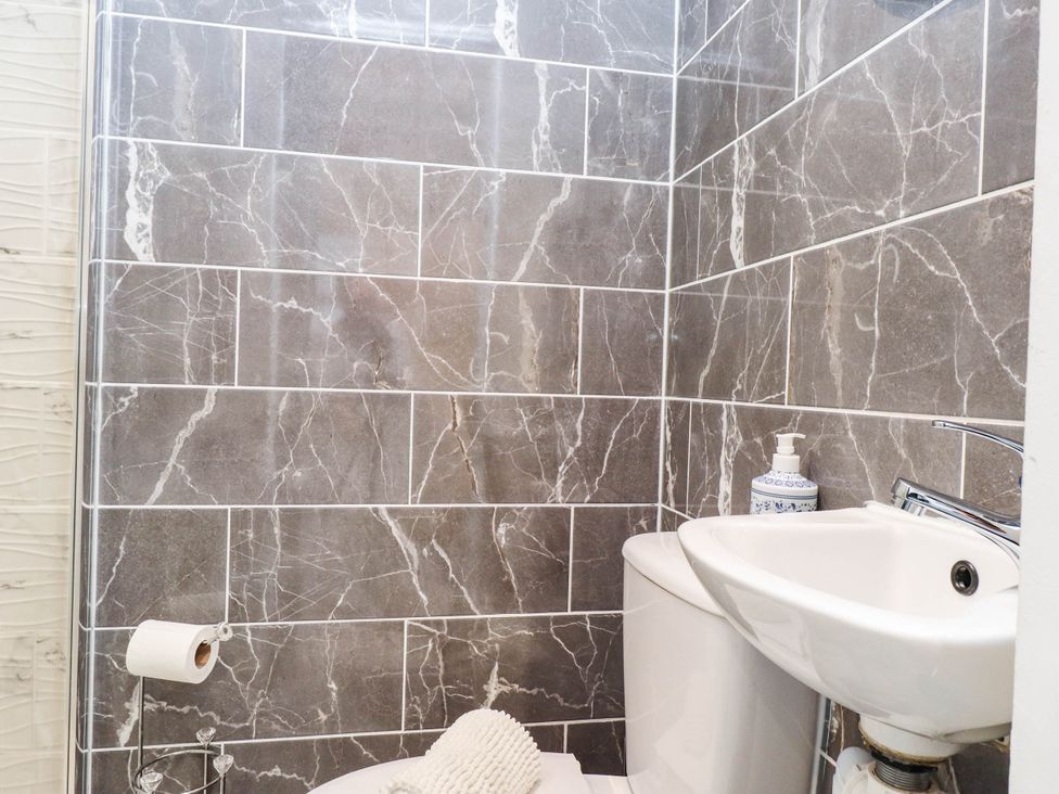 A bathroom with a shower and sink at Tyddyn Elidir near Old Colwyn