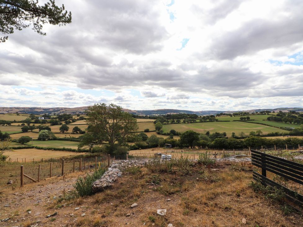 A landscape view with trees and fields near Old Colwyn