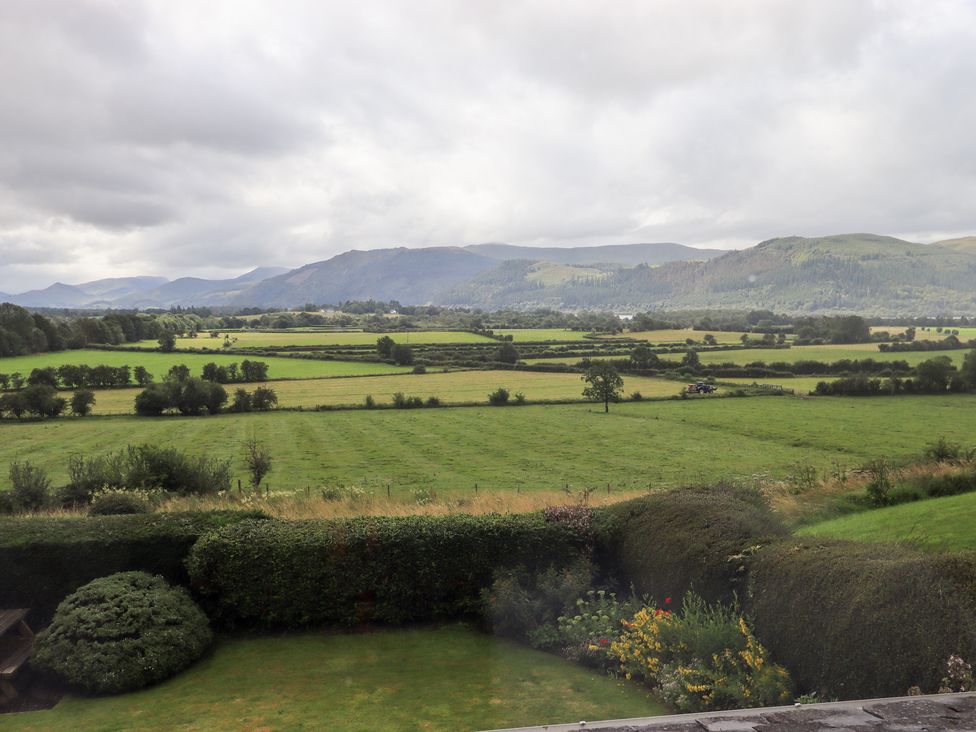 A view of hills and fields from a property at Squirrel Cottage in Bassenthwaite