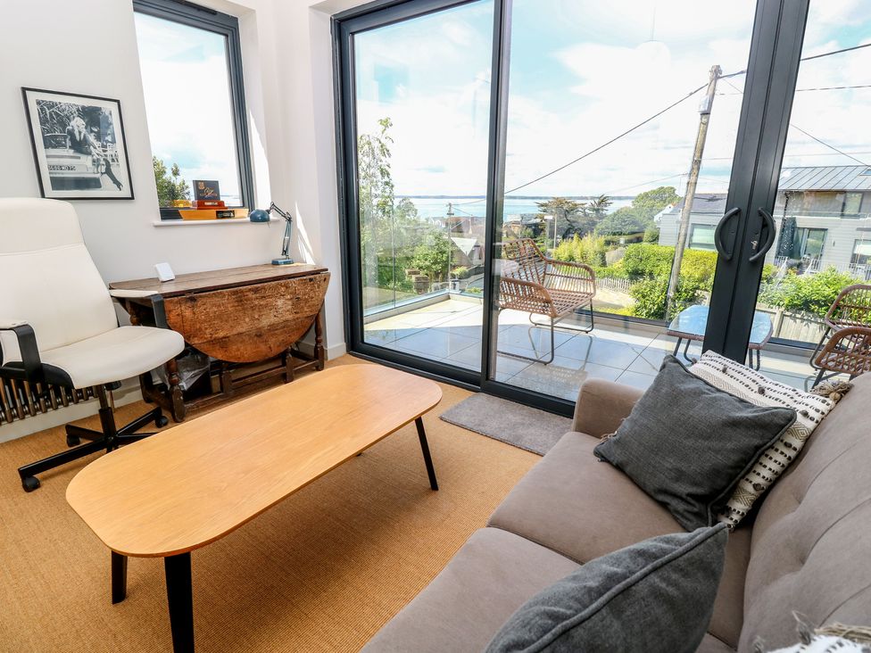 A living room with a coffee table and sofa at Aquanaut in Gurnard