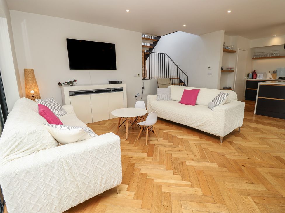 A living room with a sofa and coffee table at Aquanaut in Gurnard
