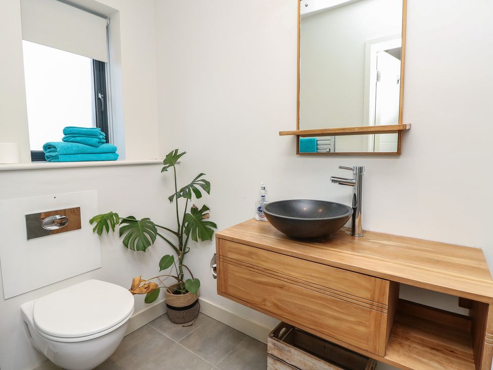 A bathroom with a sink and a toilet at Aquanaut in Gurnard