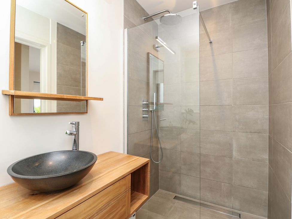 A bathroom with a shower and basin at Aquanaut in Gurnard