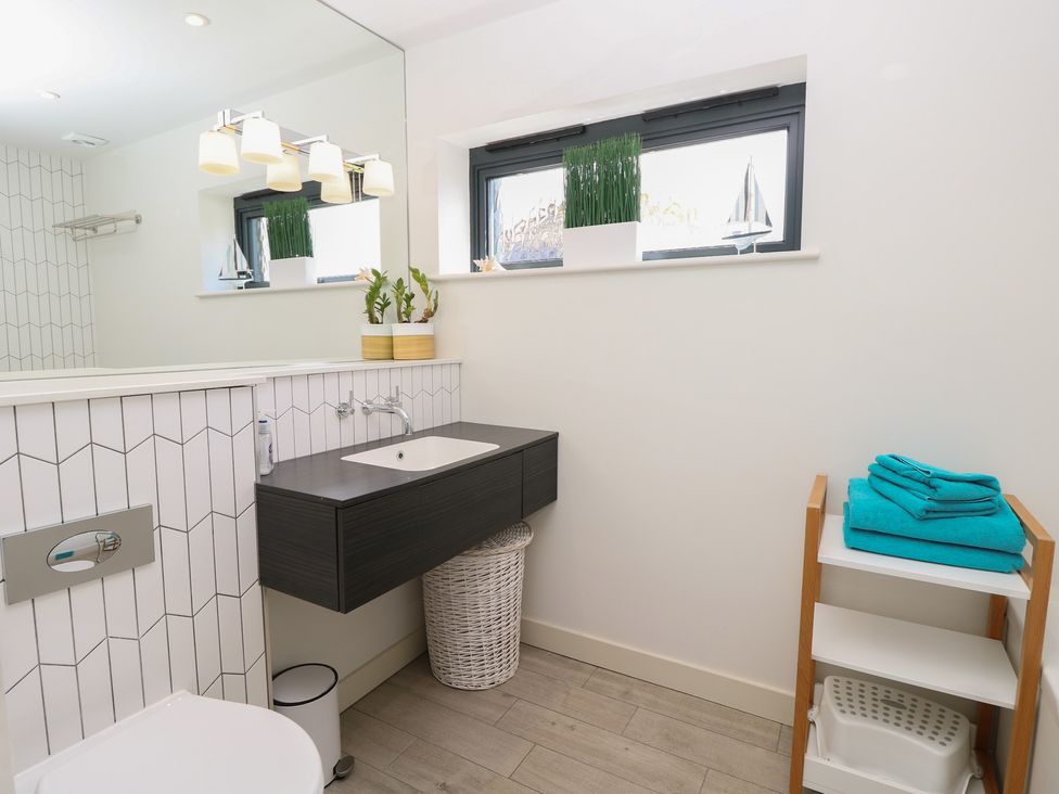 A bathroom with a sink and toilet at Aquanaut in Gurnard
