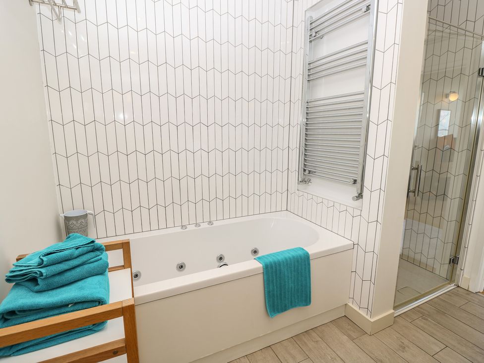 A bathroom with a bathtub and shower at Aquanaut in Gurnard