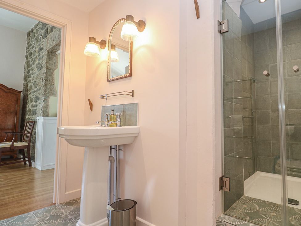 A bathroom with a sink and shower at Penmarth House in Coverack
