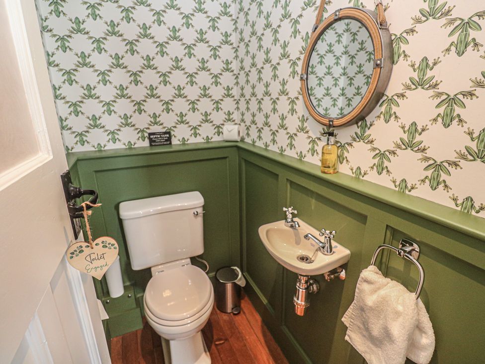 A bathroom with toilet and sink at Penmarth House in Coverack