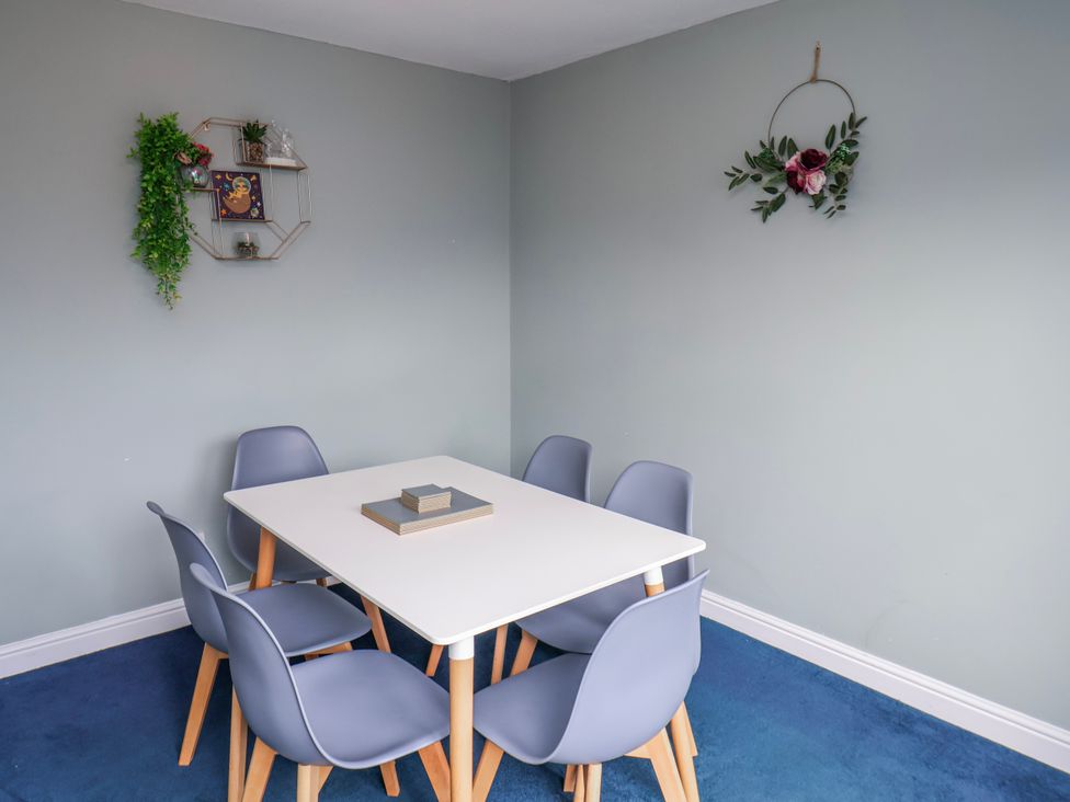 A dining room with a table and chairs at 34 Fountain Close, Whitby