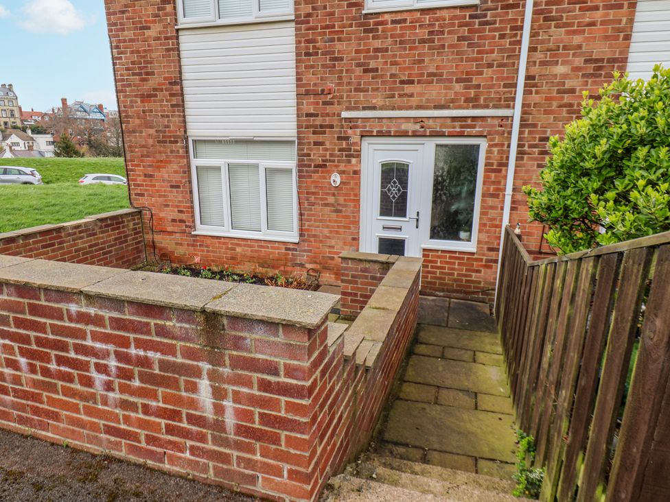An exterior view of a property with a door and window at 34 Fountain Close Whitby