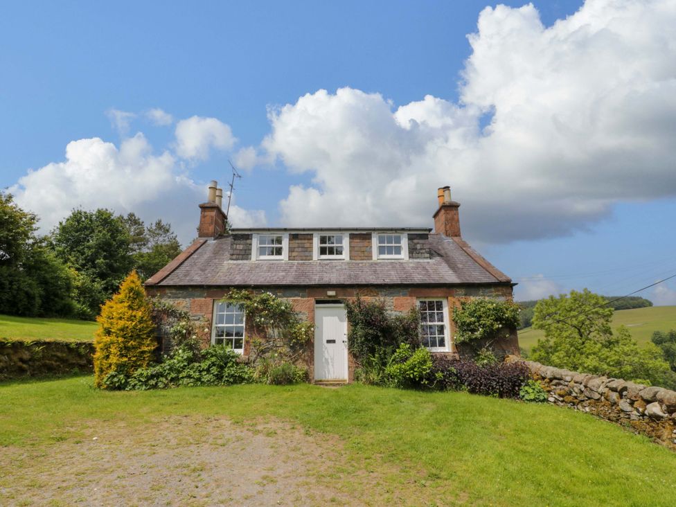 A cottage with greenery and a driveway at Townhead of Auchenbainzie near Thornhill