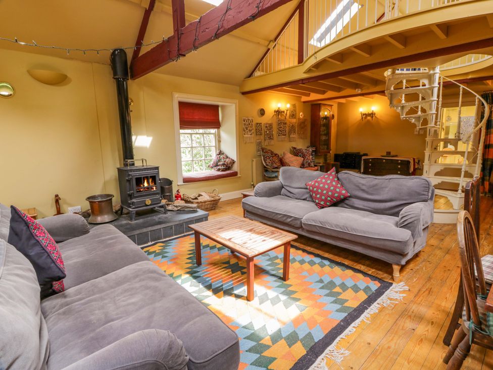 A living room with a coffee table and sofas at Townhead of Auchenbainzie near Thornhill