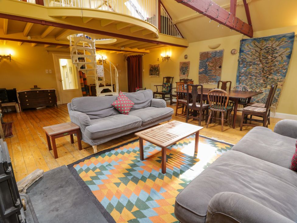 A living room with a sofa and coffee table at Townhead of Auchenbainzie near Thornhill