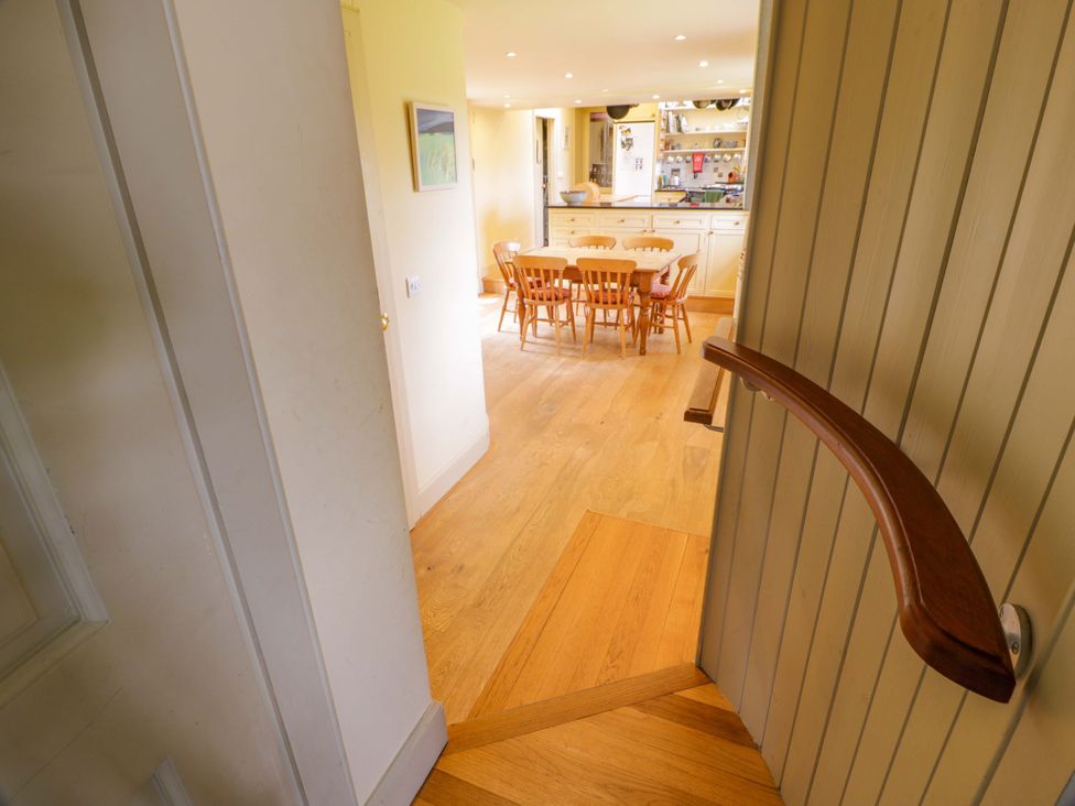 A dining area with a table and chairs at Townhead of Auchenbainzie near Thornhill