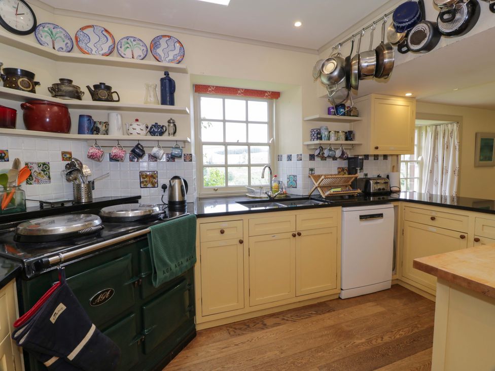 A kitchen with shelves and a sink at Townhead of Auchenbainzie near Thornhill