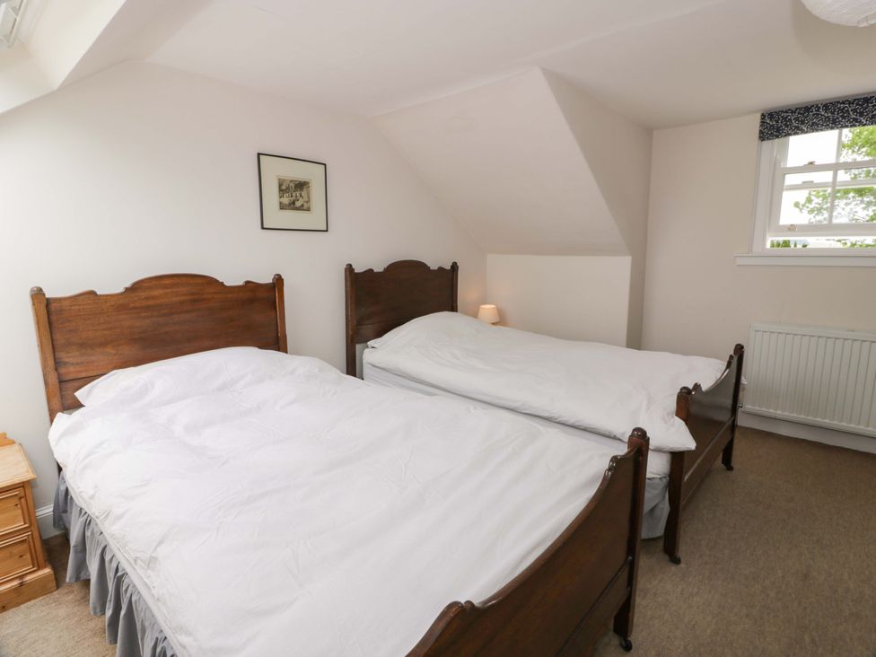 A bedroom with two beds and a lamp at Townhead of Auchenbainzie near Thornhill