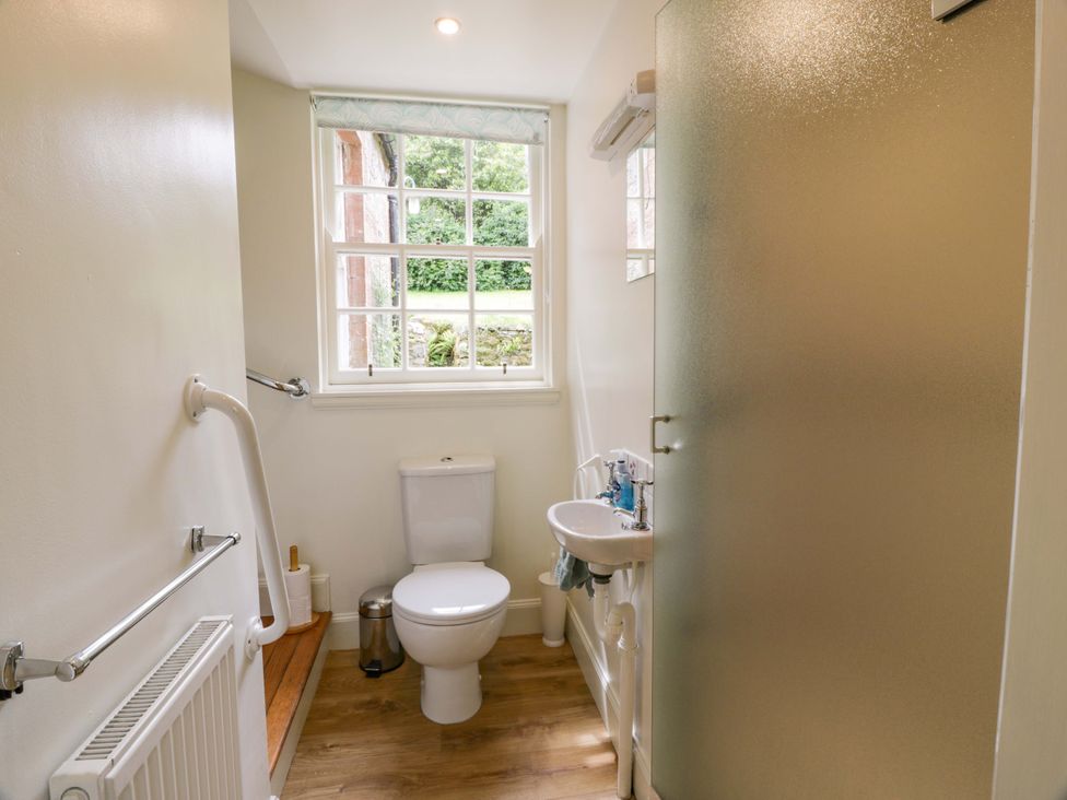 A bathroom with a toilet and sink at Townhead of Auchenbainzie near Thornhill