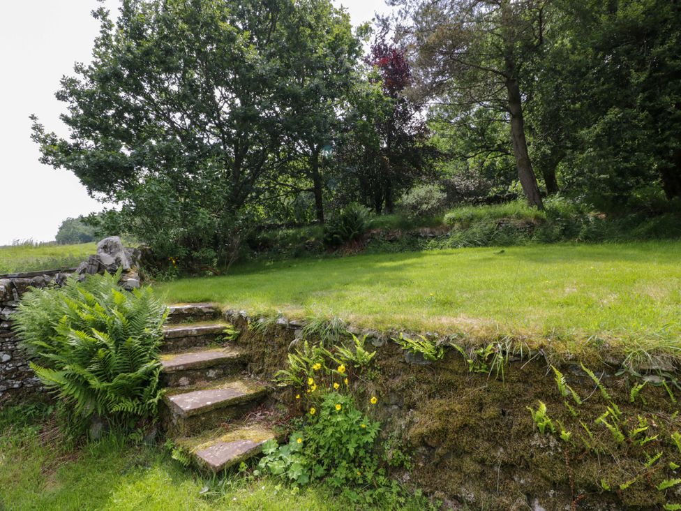 A garden with steps leading to a lawn at Townhead of Auchenbainzie near Thornhill