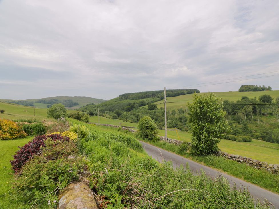 A view of a road and fields at Townhead of Auchenbainzie near Thornhill