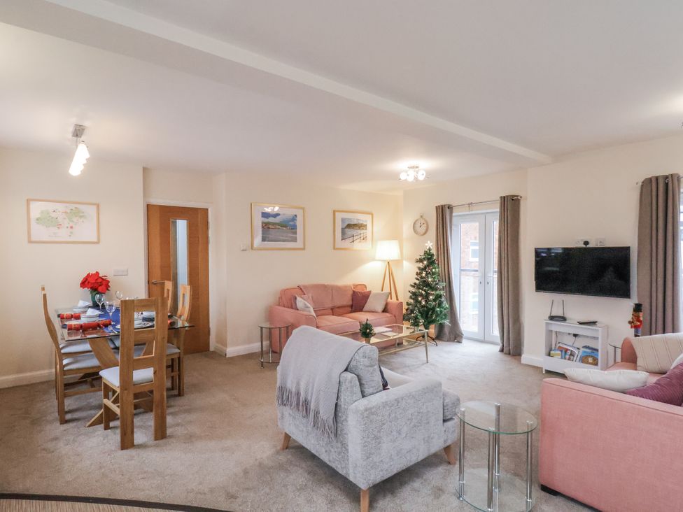 A living room with a sofa and dining table at Weydale Avenue in Scarborough