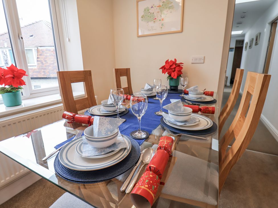 A dining room with table set for dinner at Weydale Avenue in Scarborough