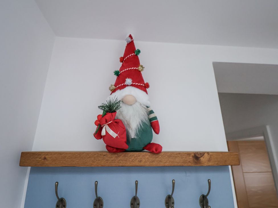 A gnome on a shelf in an entryway at Weydale Avenue, Scarborough