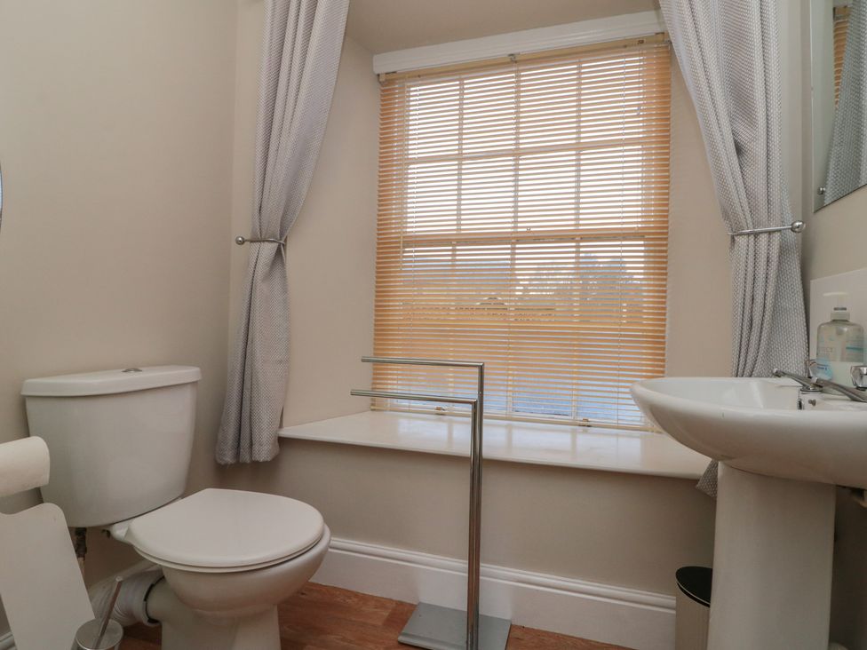 A bathroom with a toilet and sink at Beck View