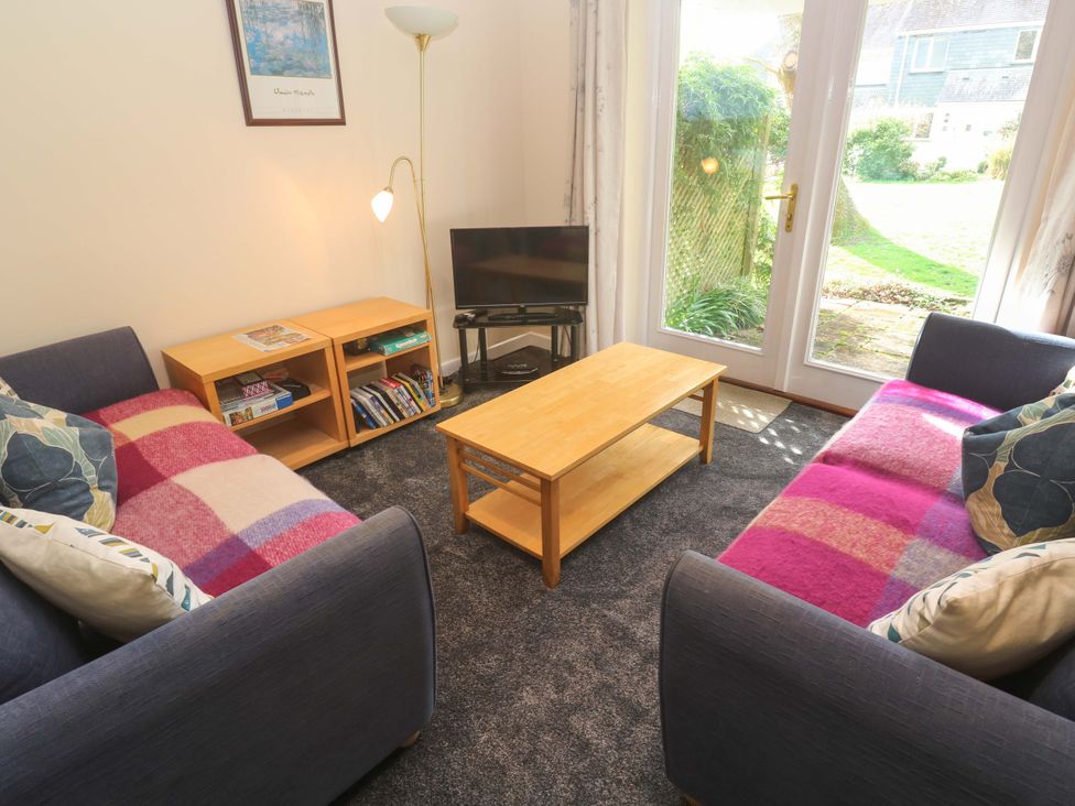 A living room with two sofas and a coffee table at Pheasants Walk in Falmouth