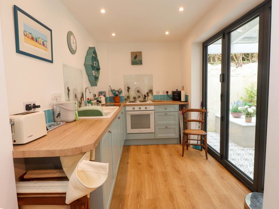 A kitchen with a sink and countertop at Bodefi in Nefyn