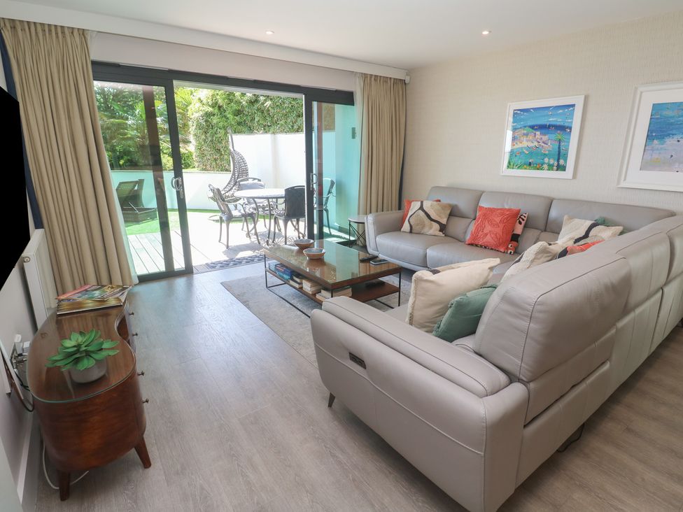 A living room with a sofa and coffee table at Peninsula Apartment 2 in St Ives