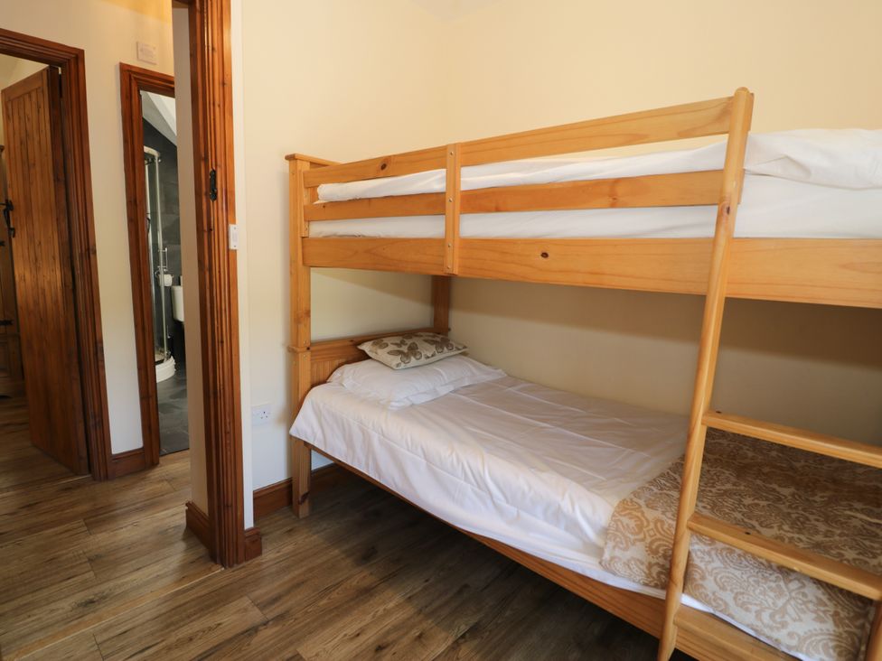 A bunk bed with mattress and pillow in a bedroom at Cornel Clyd in Dolwen near Abergele