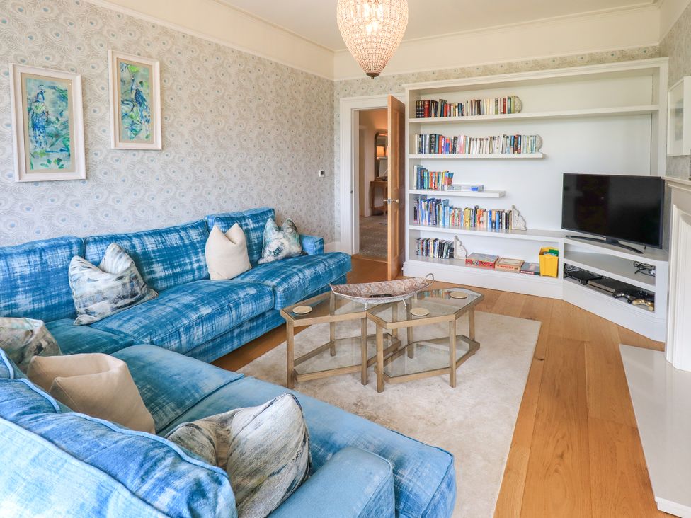A living room with a sofa and a television at Fern Bank in Penrith