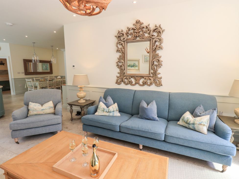 A living room with a sofa and armchairs at Fern Bank in Penrith