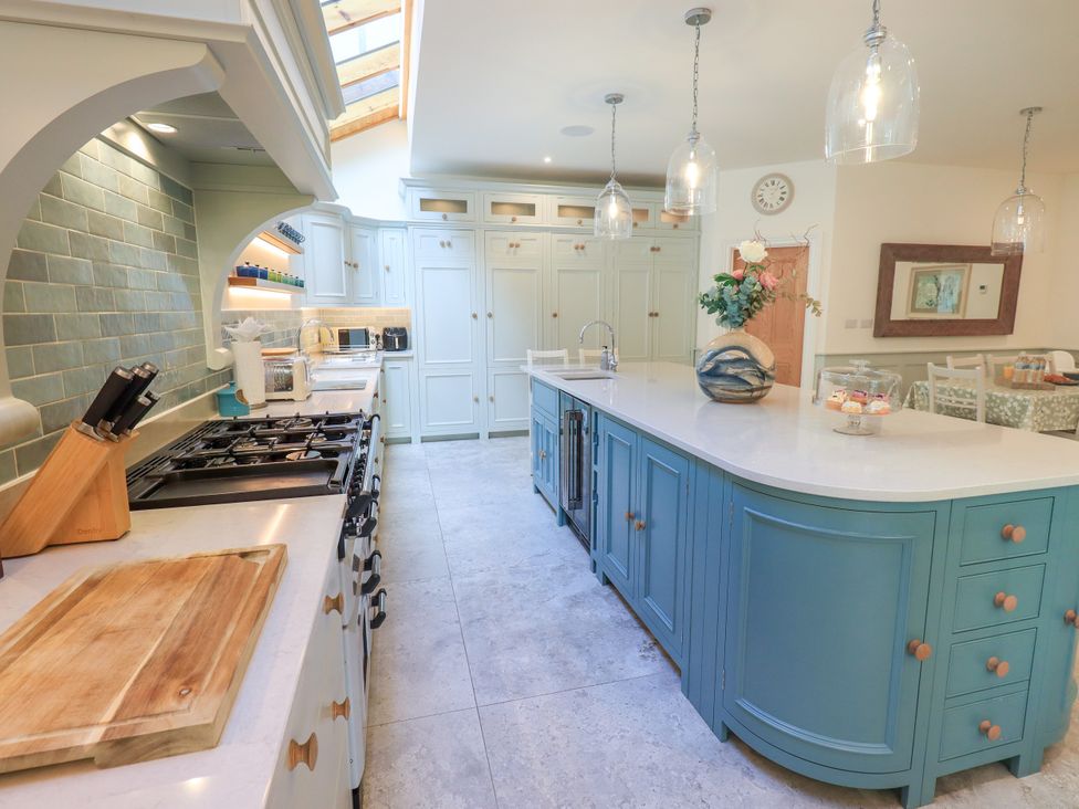 A kitchen with a countertop and cabinets at Fern Bank in Penrith