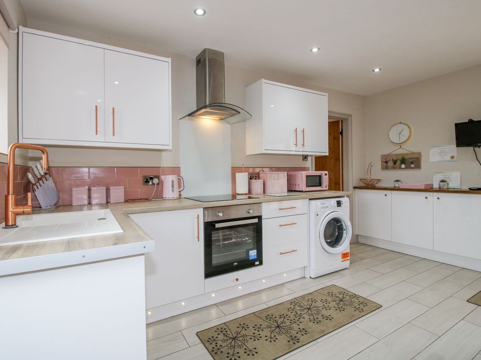 A kitchen with modern appliances at Meadow Barn Aston On Clun