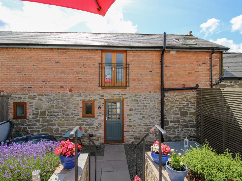 An outdoor area with steps and flower pots at Meadow Barn Aston On Clun