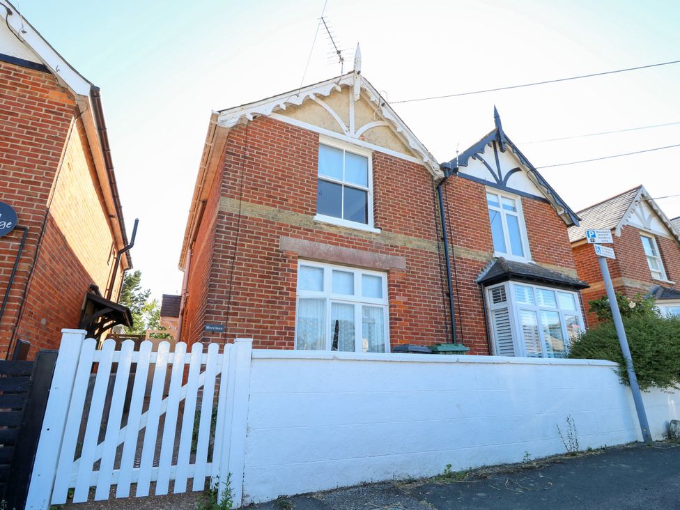 A house with a fence and windows at Merrilees in Yarmouth