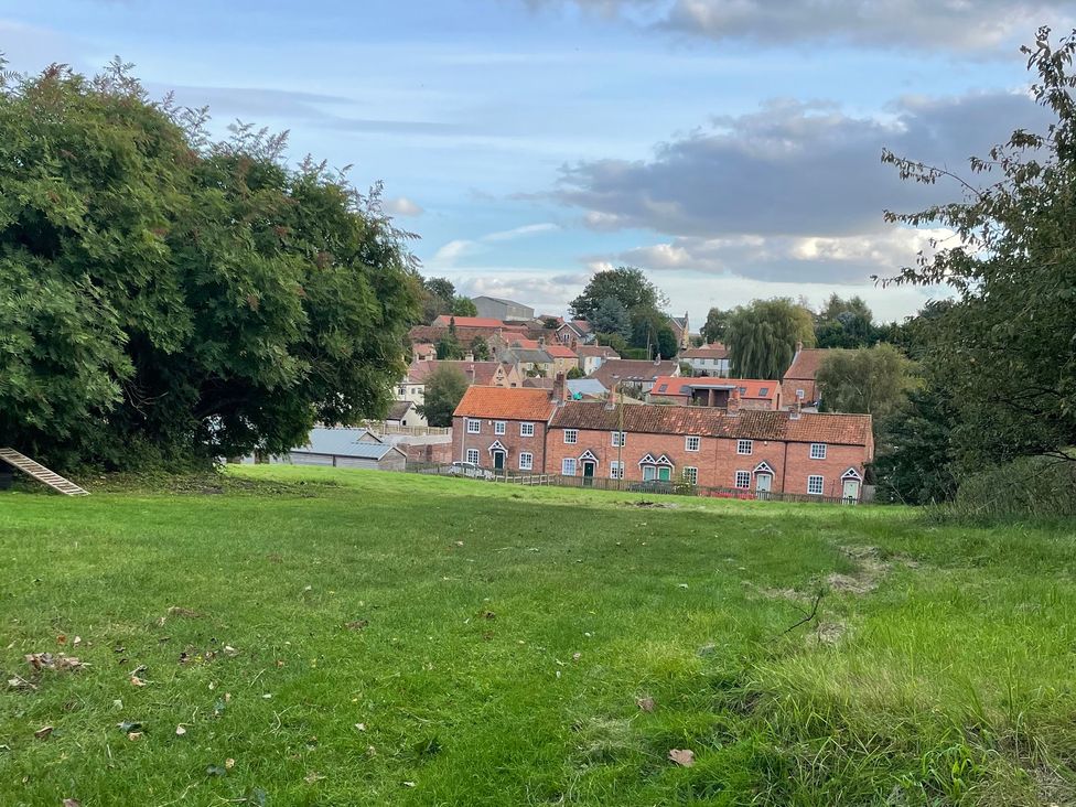 A view of houses with greenery and sky at Marmaduke Cottage in Sancton near Market Weighton