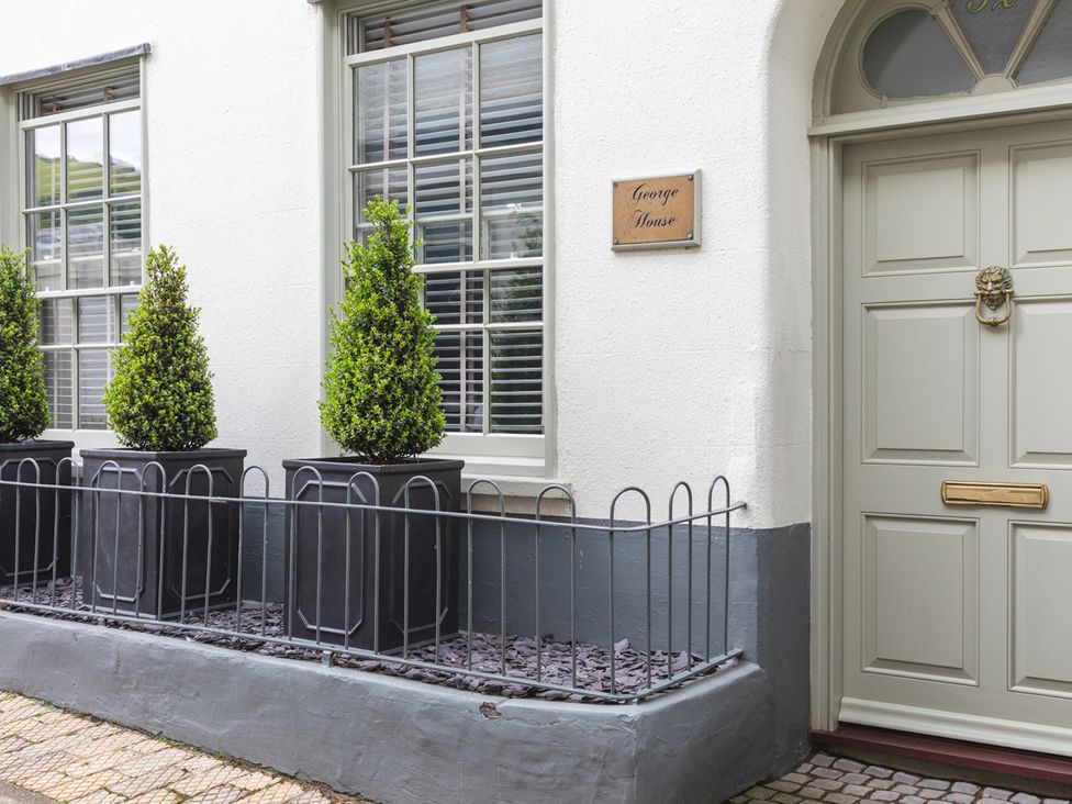 An outdoor area with a door and plants at George House in Dartmouth