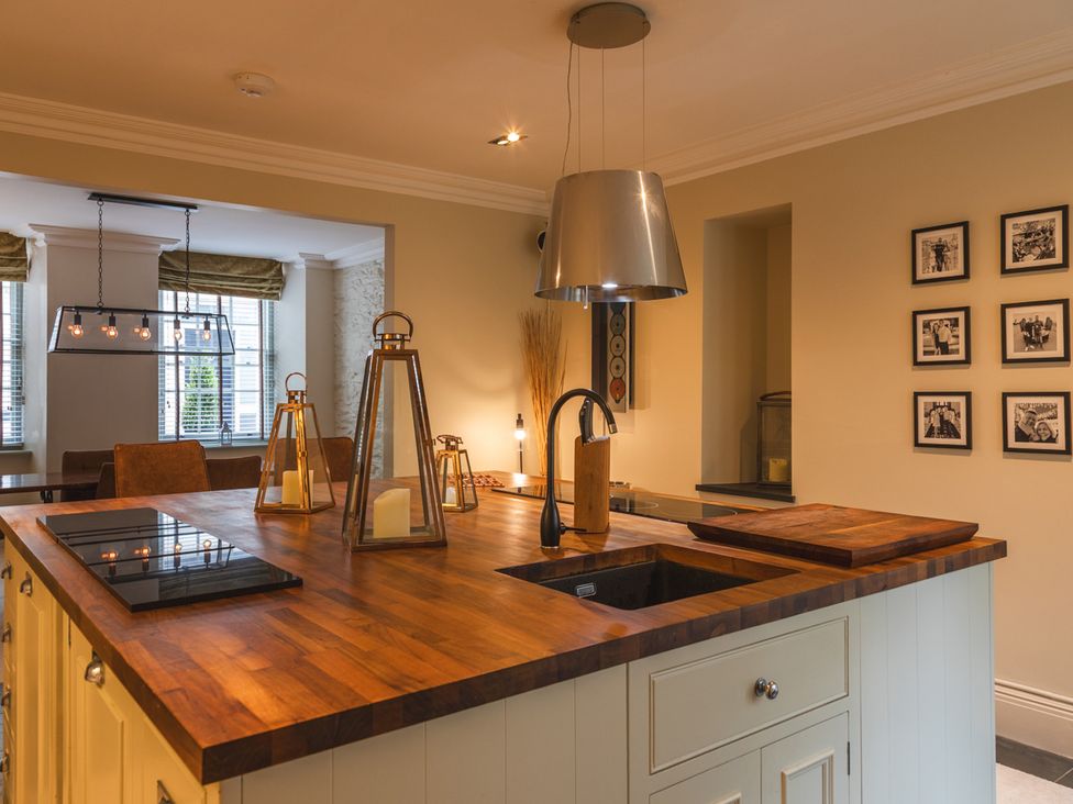 A kitchen with an island and a sink at George House in Dartmouth