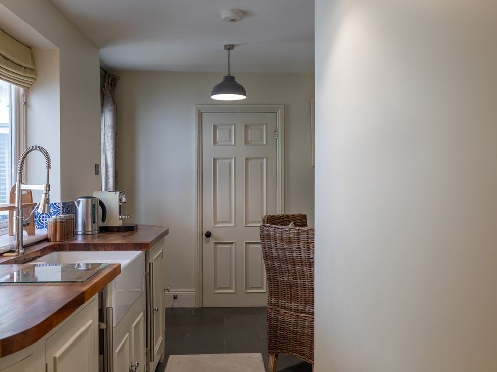 A kitchen with a sink and kettle at George House in Dartmouth