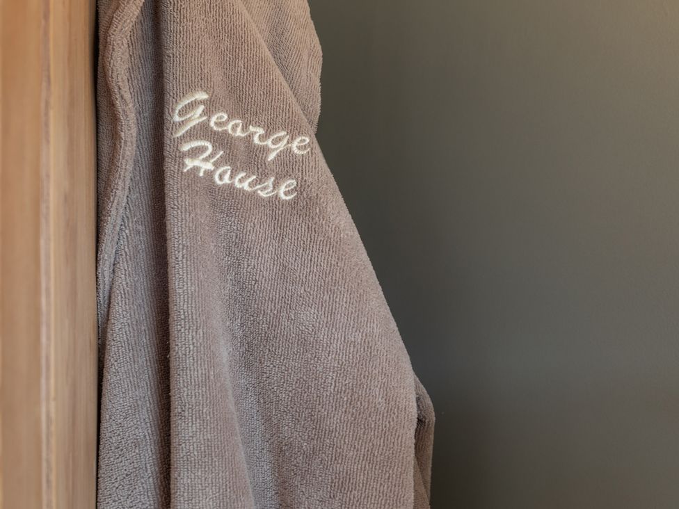 A towel with embroidered text at George House in Dartmouth
