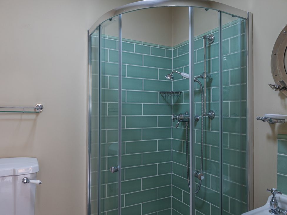 A bathroom with a shower and toilet at George House in Dartmouth