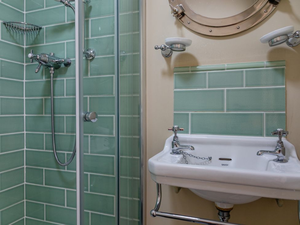 A bathroom with a shower and a sink at George House Dartmouth